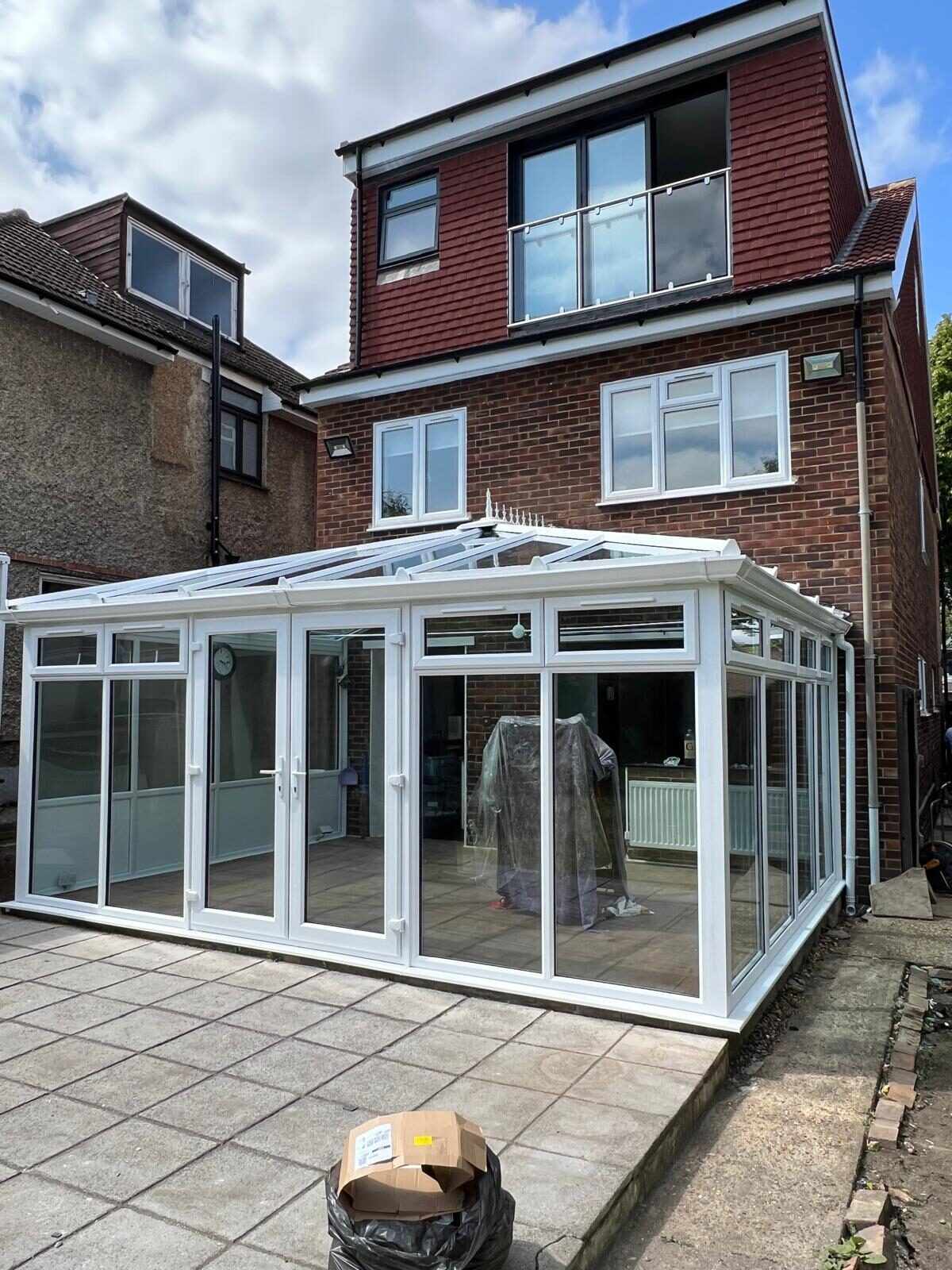 Compact white uPVC conservatory on a rear elevation